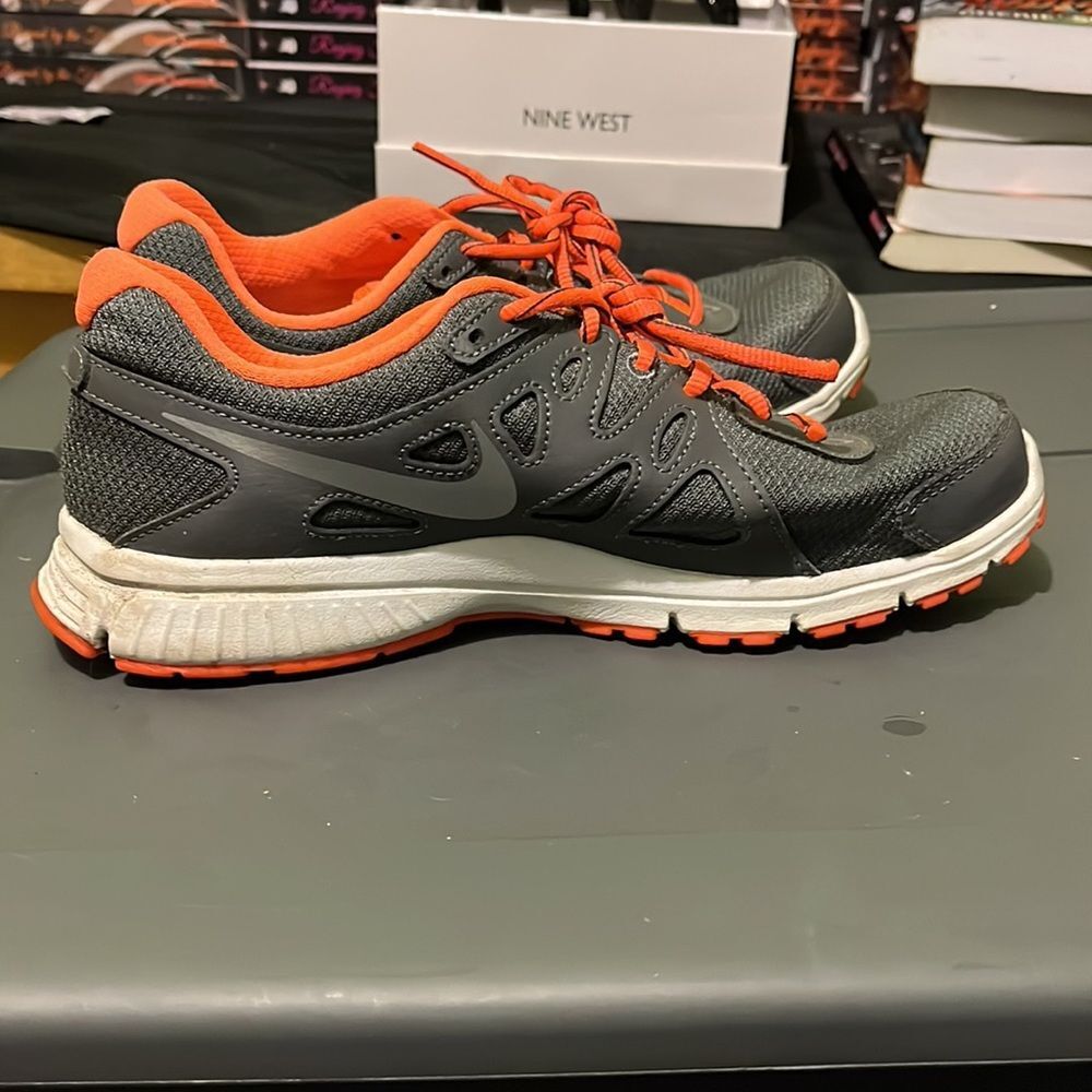 Women’s Nike, Size 9, neon orange, gray, and white